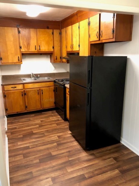 Murfreesboro, TN Studios for Rent - Poplar Village - Kitchen with  Hardwood Floor, Wooden Cabinets, and Efficient Appliances.
